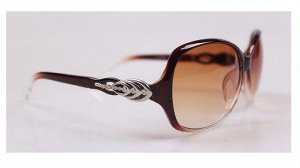 Солнцезащитные очки коричневые с декоративным элементом на дужке