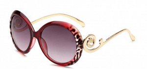 Солнцезащитные очки красно-леопардовые круглые с завитушкой на дужке