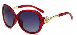 Солнцезащитные очки красные с завитушками на дужках