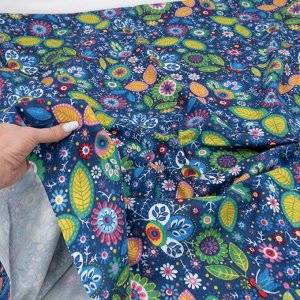 Ткань на отрез фланель 150 см Цветные цветы на синем