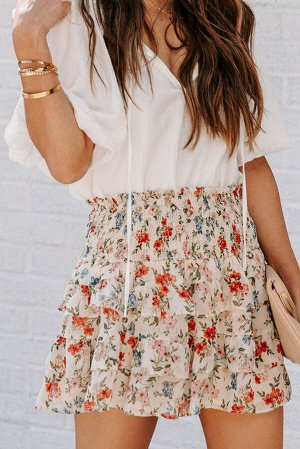Бежевая многоярусная мини-юбка с цветочным принтом