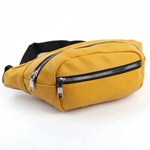 Сумка 33 x 10 x 7 см. Поясная сумка из искусственной кожи желтого цвета. Имеет карман на молнии, одно отделение на молнии и текстильный, регулируемый ремень с пластиковой застежкой фастекс.