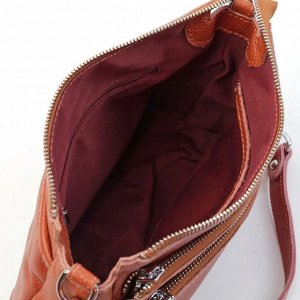 Сумка 25 х 17 х 8 см. Женская сумка через плечо из натуральной мягкой кожи рыжего цвета. Имеет три наружных кармана на молниях; два на передней стенке и один на задней.  Сумка закрывается на молнию. В