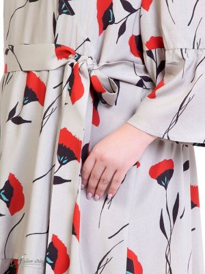 Платье Легкое платье из натуральной ткани с оригинальным цветочным рисунком. Модель с завышенной линией талии. Нижняя часть полочки обработана с широким «запахом» и оканчивается воланом. Модель компле