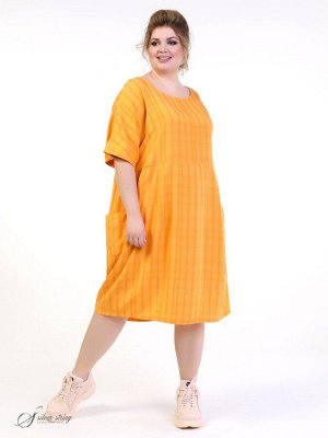 Платье Оригинальное летнее платье длиной «за колено» изготовлено из современного материала- тенсел. Модель силуэта "бочонок", с цельнокроеным рукавом, длиной по локоть. Горловина скругленной формы, сл