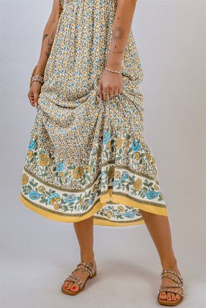 Бежевое платье с цветочным принтом на тонких бретелях