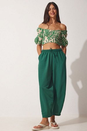 Женские льняные вискозные брюки-шалвар изумрудно-зеленого цвета с карманами CV00001