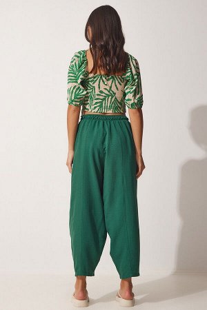Женские льняные вискозные брюки-шалвар изумрудно-зеленого цвета с карманами CV00001