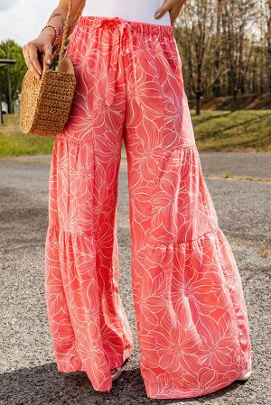 Розовые многоярусные брюки-клеш с флористическим принтом