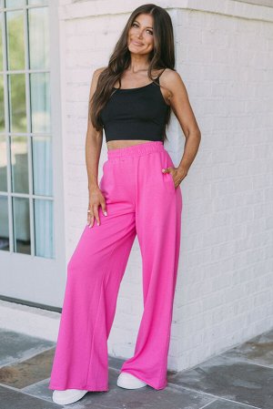 Розовые брюки свободного кроя с эластичным поясом
