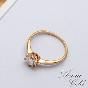 Кольцо Позолоченное розовым золотом 750 пробы (18K Gold Plated) кольцо c супер блестящим прозрачным многогранным фианитом! Размер камня: 5 мм. Цвет золота, как в России!