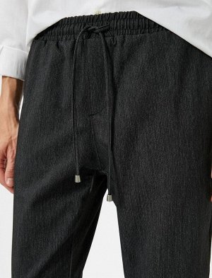 Тканевые брюки, приталенный крой, кружевная талия, узкий карман на штанинах