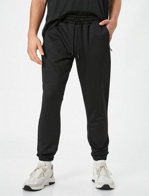 Спортивные брюки-джоггеры с карманом на молнии на кружевной талии