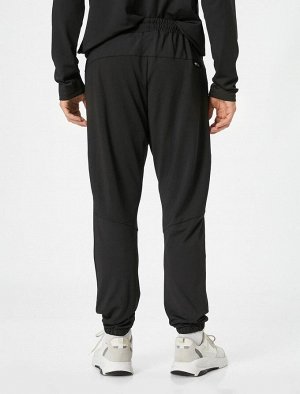 Спортивные брюки-джоггеры с карманом на молнии и кружевной талией