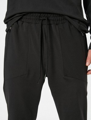 Спортивные брюки-джоггеры с карманом на молнии и кружевной талией