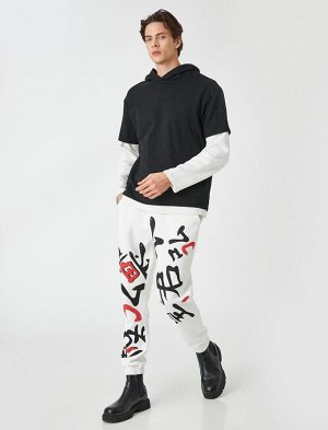Спортивные брюки-джоггеры с дальневосточным принтом, кружевной талией и карманом