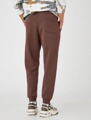 Базовые спортивные штаны-джоггеры с кружевным поясным карманом