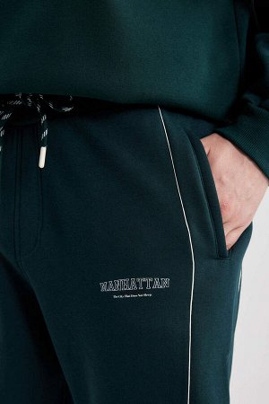 Фланелевые спортивные штаны стандартного кроя с эластичными карманами и карманами