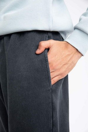 Спортивные штаны стандартного кроя с карманами и эластичной окантовкой