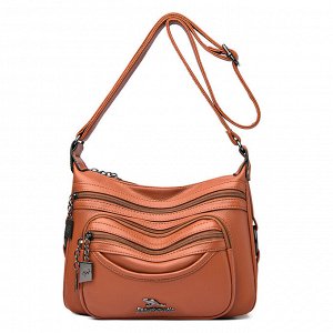 Женская мягкая сумка почтальонка из эко кожи, с широким ремешком и декоративными металлическими пуллерами, цвет желто-коричневый