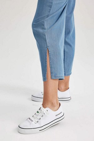 Джинсовые брюки-кюлоты длиной до щиколотки с высокой талией и разрезом
