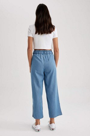 Джинсовые брюки-кюлоты длиной до щиколотки с высокой талией и разрезом