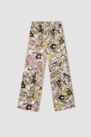 Атласные брюки из вискозы с расклешенным кроем и цветочным узором