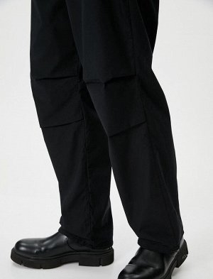 Свободные брюки оверсайз-парашют с кружевными карманами на талии