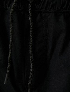 Свободные брюки оверсайз-парашют с кружевными карманами на талии