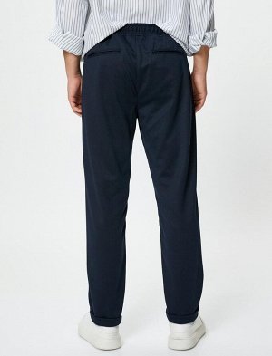 Тканевые брюки с зауженным кроем на кружевной талии и карманами