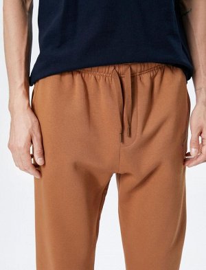 Спортивные штаны Jogger с кружевным поясом и карманом с детальной вышивкой
