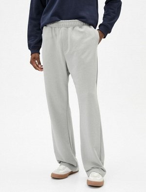 Спортивные штаны оверсайз с эластичным поясом, карманами и широкими штанинами