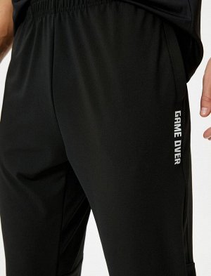 Спортивные штаны Jogger с принтом и эластичным карманом на талии