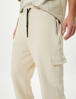 Спортивные брюки-карго с карманом на кружевной талии