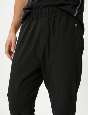 Спортивные брюки Jogger с эластичной резинкой на талии и карманом на молнии