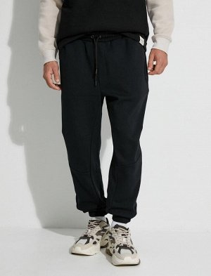Спортивные брюки-джоггеры с карманом на молнии, шнуровкой на талии и строчкой