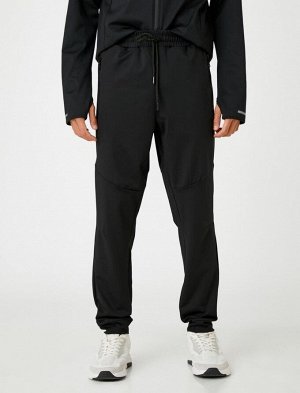Базовые спортивные брюки-джоггеры с карманом на молнии и завязкой на талии