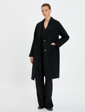 Пальто оверсайз с длинными манжетами, двубортным карманом на пуговицах