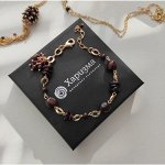 Браслет с гранатами и кисточкой