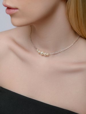 Украшение на шею с кремовыми бусинами различного размера