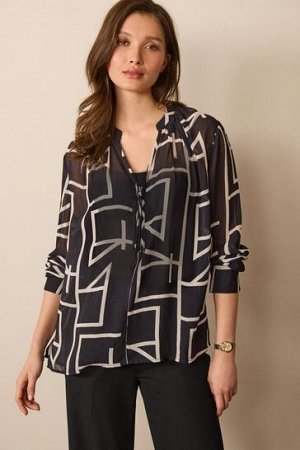 Прозрачная блузка с V-образным вырезом, молнией и длинными рукавами с манжетами.