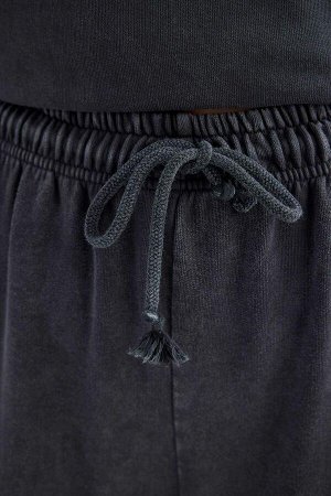 Широкие моющиеся спортивные штаны с эффектом потертостей