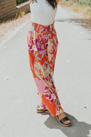 Оранжевые брюки широкого кроя с цветочным принтом в стиле Бохо