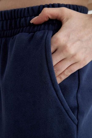 Моющиеся спортивные штаны с широкими штанинами и эффектом потертостей