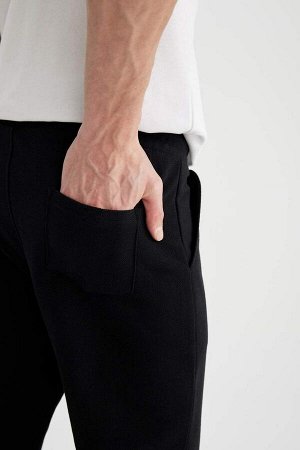 Гибкие спортивные штаны узкого кроя из пике