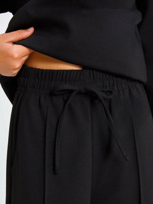 Расклешенные брюки для девочек в черном цвете