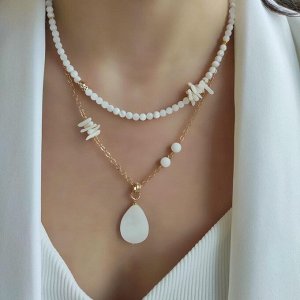 Сет из перламутра и белого коралла в позолоченой фурнитуре