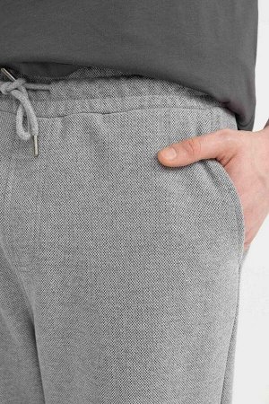 Гибкие спортивные штаны узкого кроя из пике