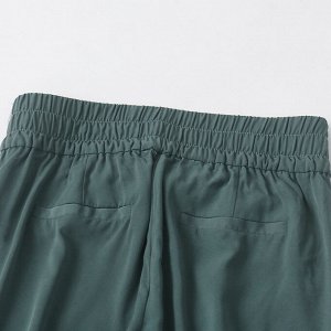 Женские легкие брюки темно-зеленого цвета, на резинке