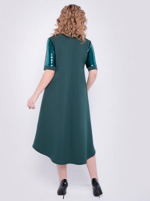 Платье Нарядное платье силуэта "трапеция" насыщенного зеленого цвета. Модель допополнена рукавами из ткани с двусторонними пайетками.
- круглый вырез горловины на внутренней обтачке
- втачные коротк